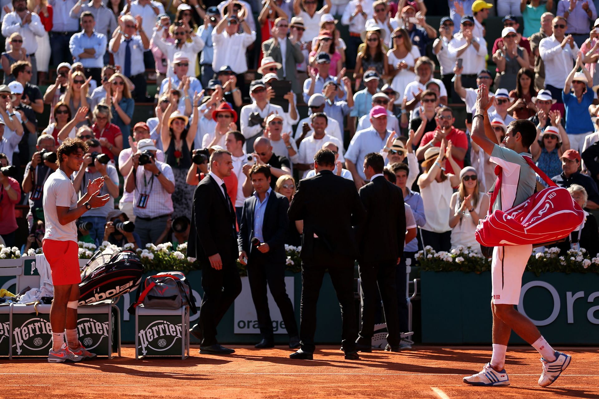 Rafael Nadal applauds as Novak Djokovic leaves the court after the pair&#039;s 2013 French Open semifinal