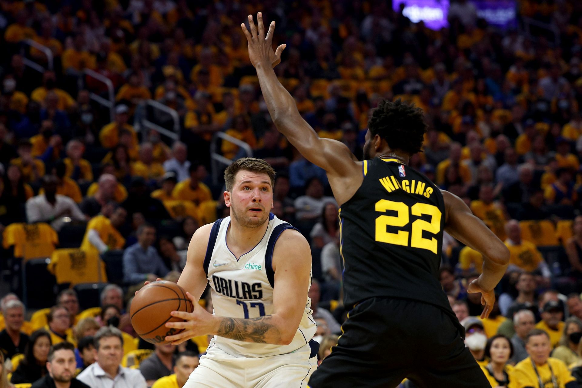 Andrew Wiggins and Luka Doncic in action