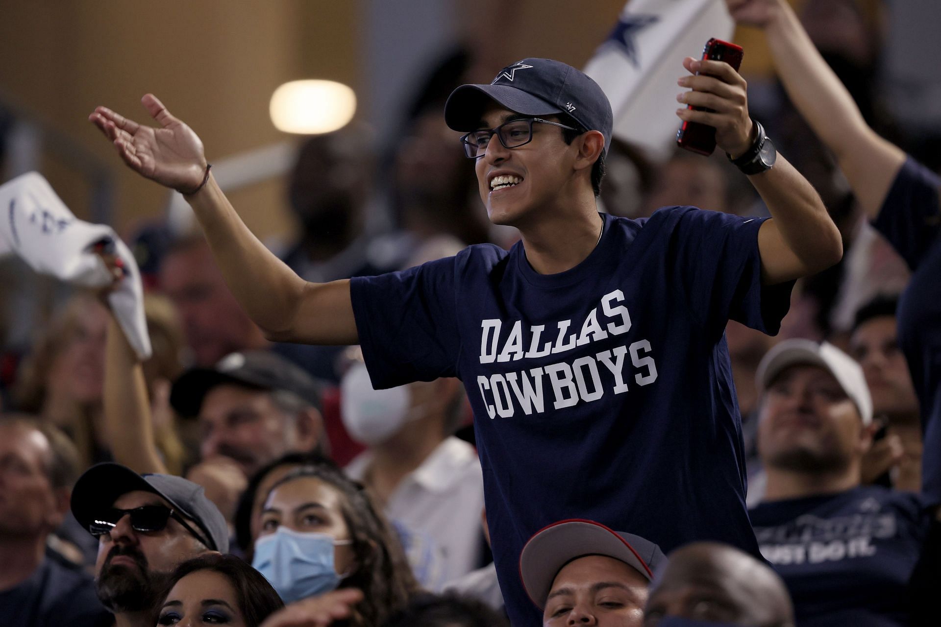 A fan of the Cowboys cheering for the team