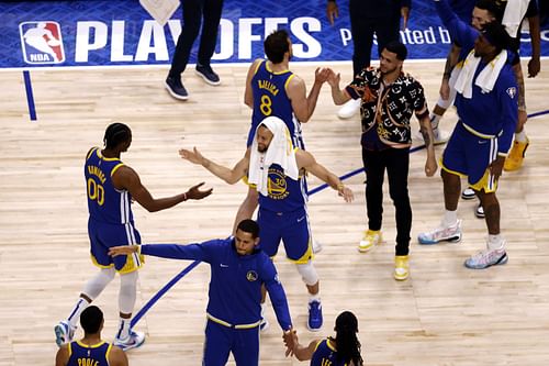 The Golden State Warriors react to a play as they head into a timeout