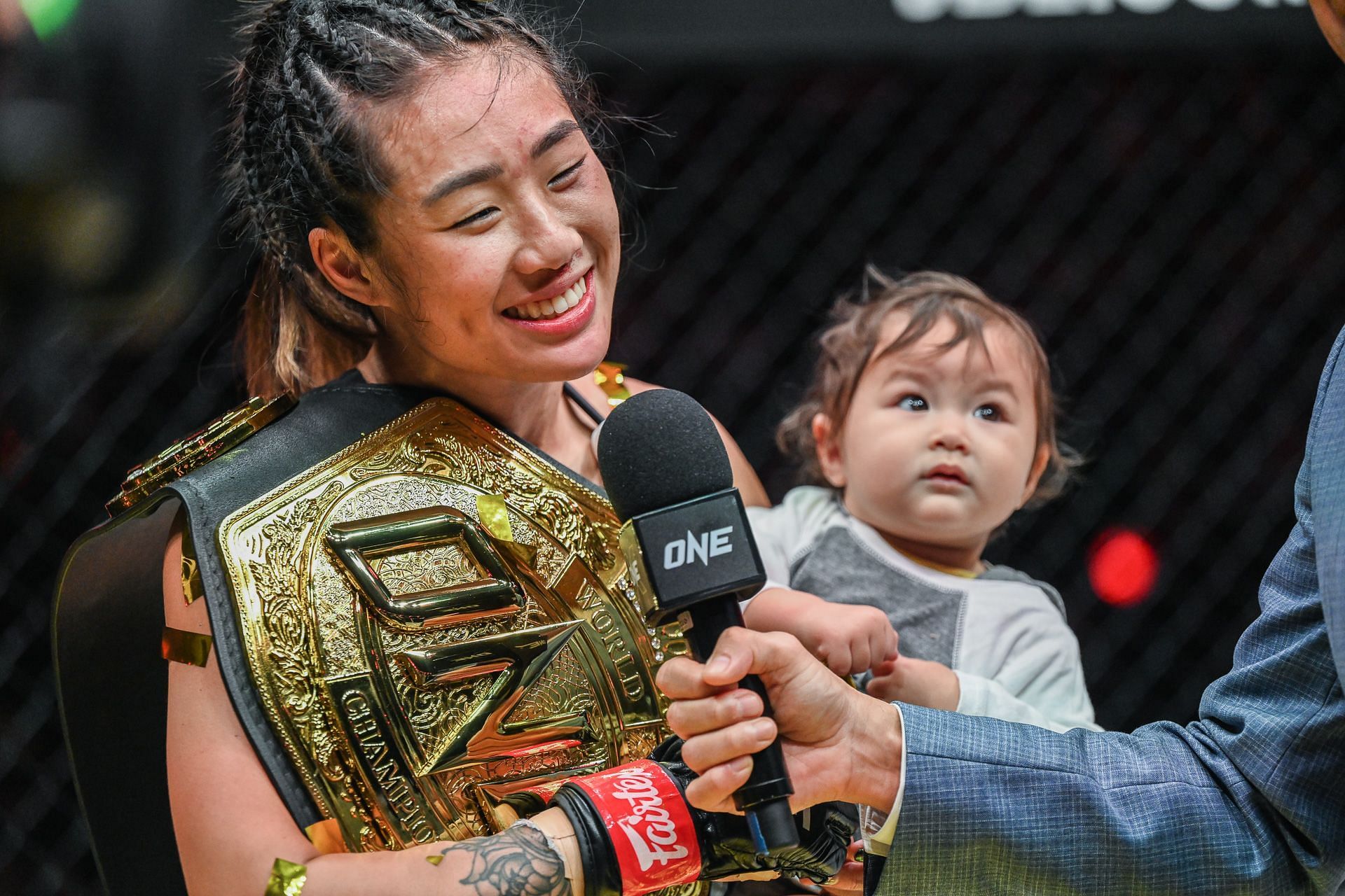 Angela Lee celebrates with her daughter [Photo Credit: ONE Championship]