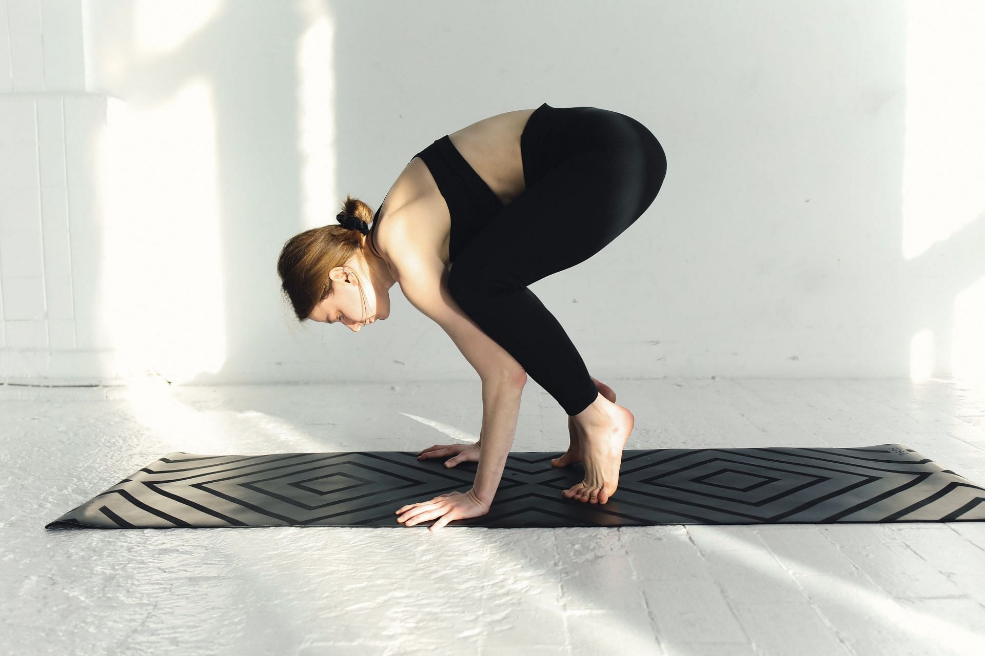Hurdler yoga pose activates your internal organs. (Image via Pexels / Polina Tankilevitch)