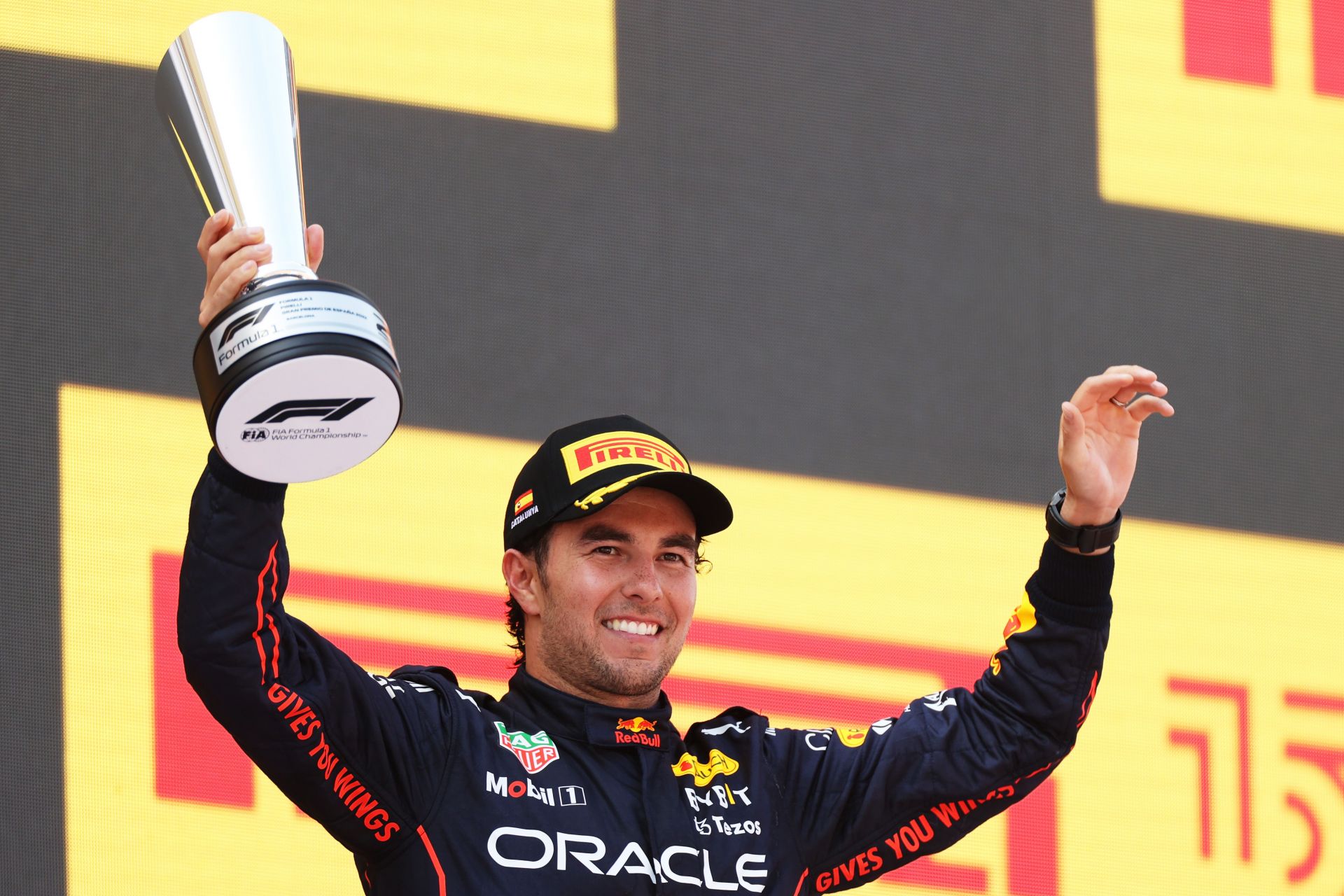 Red Bull Sergio Perez holds aloft the second place trophy on the podium at the 2022 F1 Spanish GP. (Photo by Peter Fox/Getty Images)