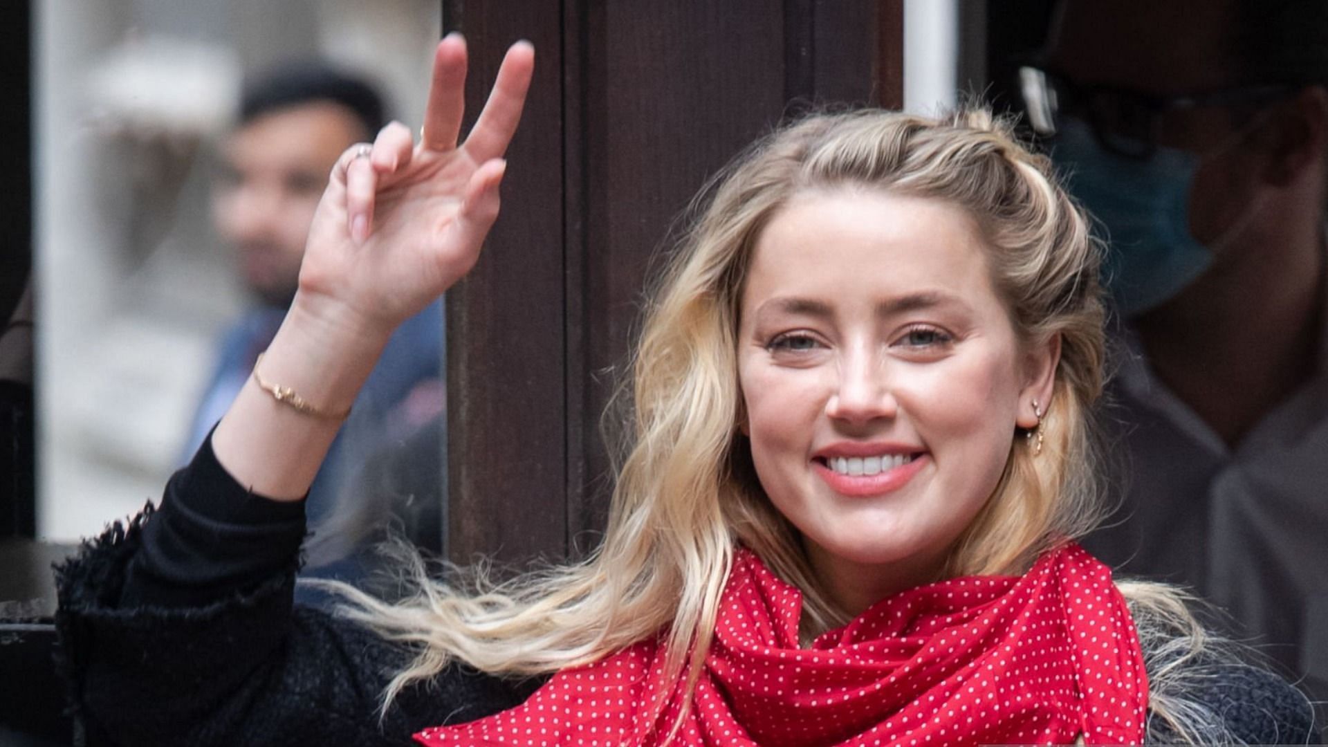 A new video showing Amber Heard allegedly hiding her water bottle in her pockets inside the court went viral online (Image via Samir Hussein/WireImage)