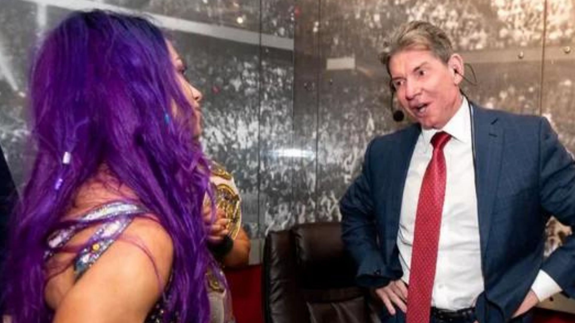 Sasha Banks and Vince McMahon.