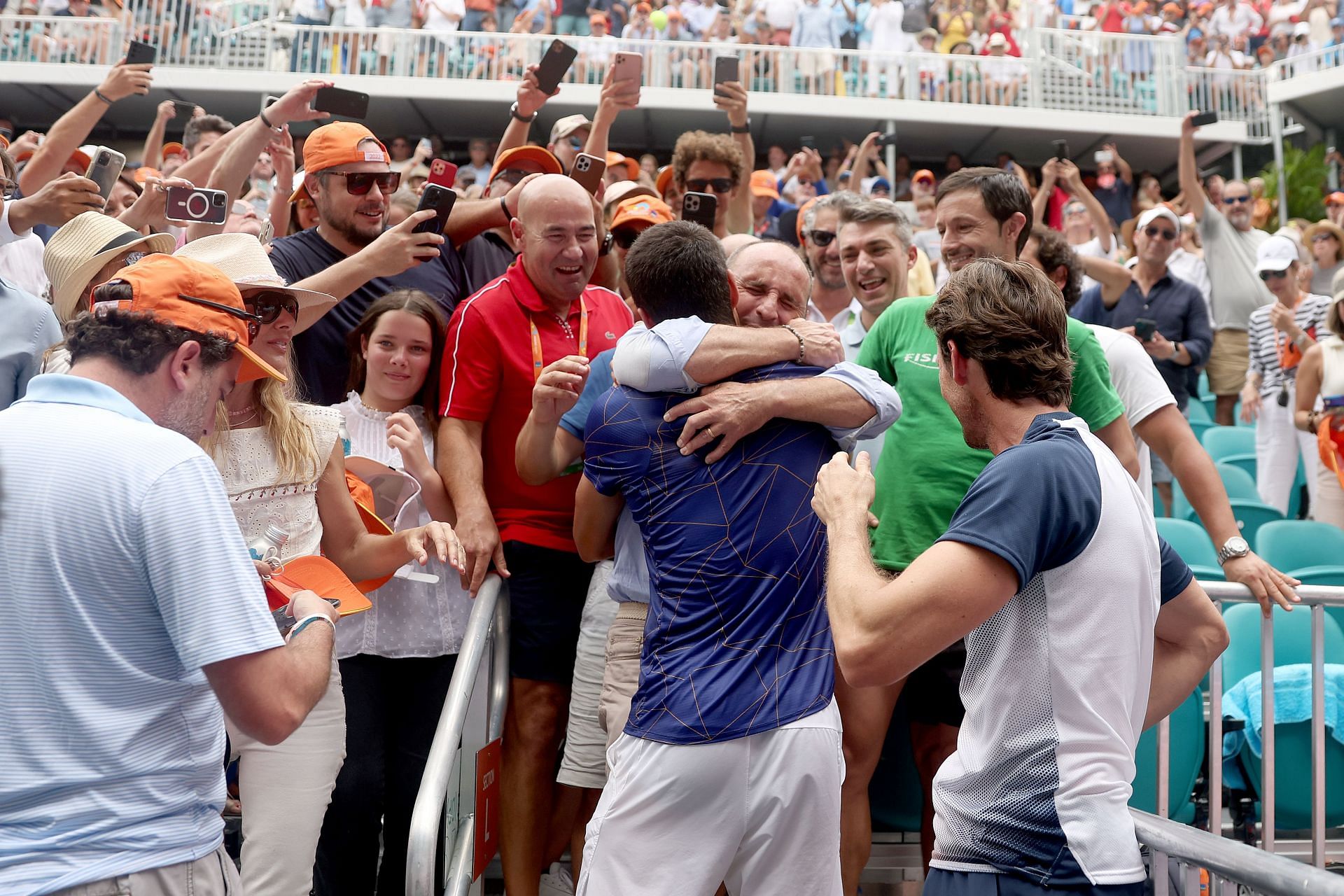 Carlos Alcaraz celebrates with coach Juan Carlos Ferrero after winning the Miami Open