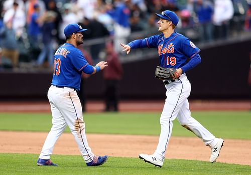 Luis Guillorme (L) and Mark Canha (R) of the New York Mets