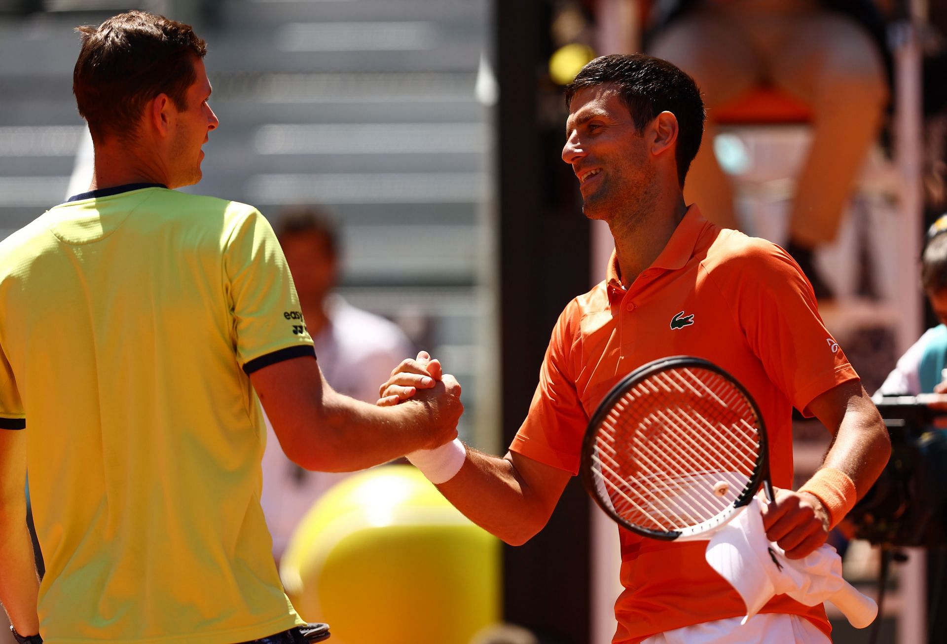 Novak Djokovic beat Hubert Hurkacz (left) in the Madrid quarterfinals on Friday.