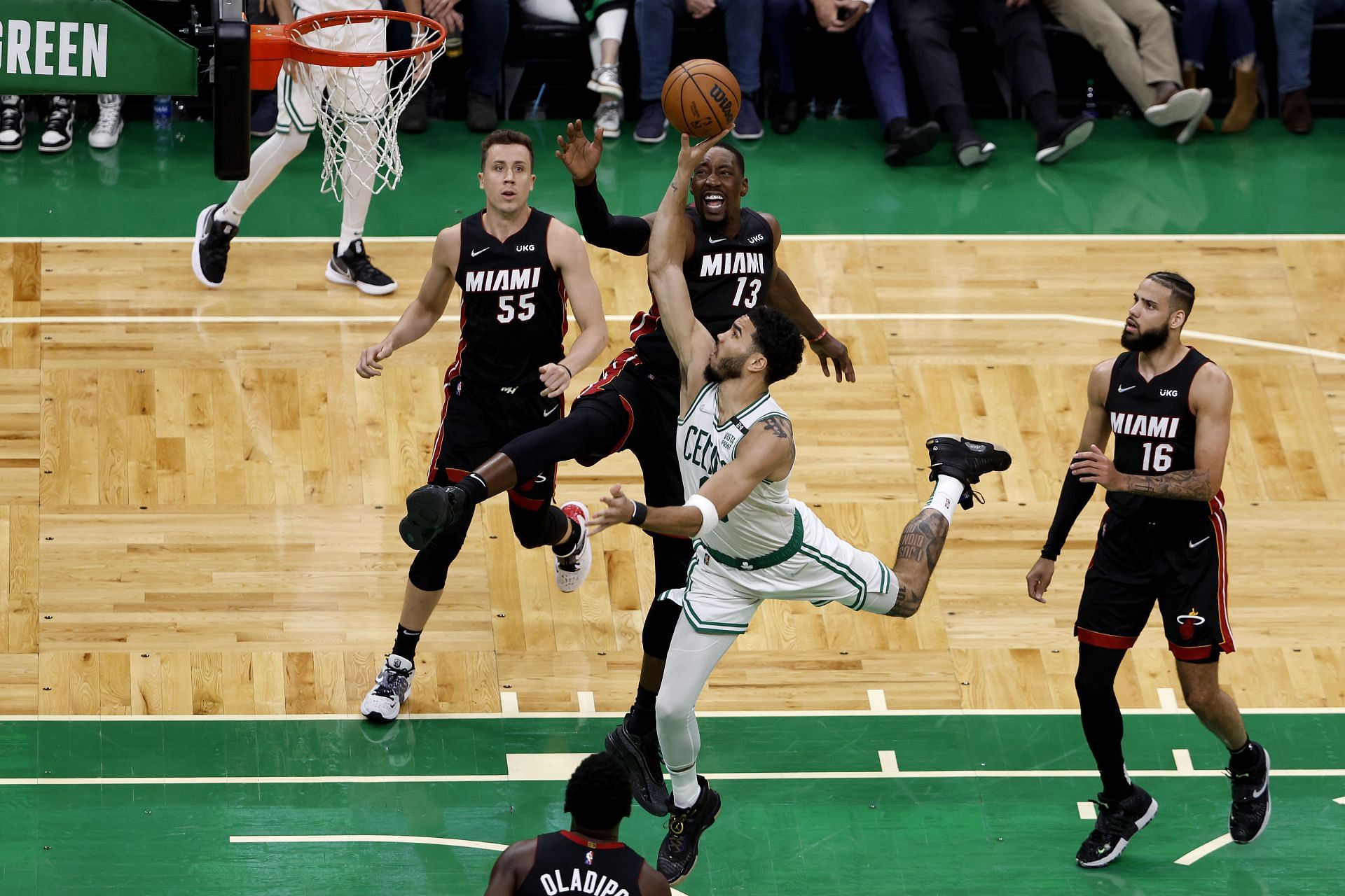 Jayson Tatum attempts a tough layup over Bam Adebayo.