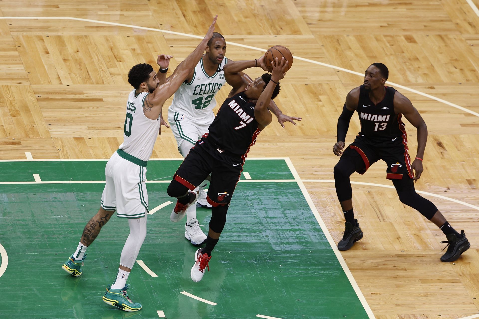 Kyle Lowry #7 of the Miami Heat looks to shoot against Jayson Tatum #0 of the Boston Celtics