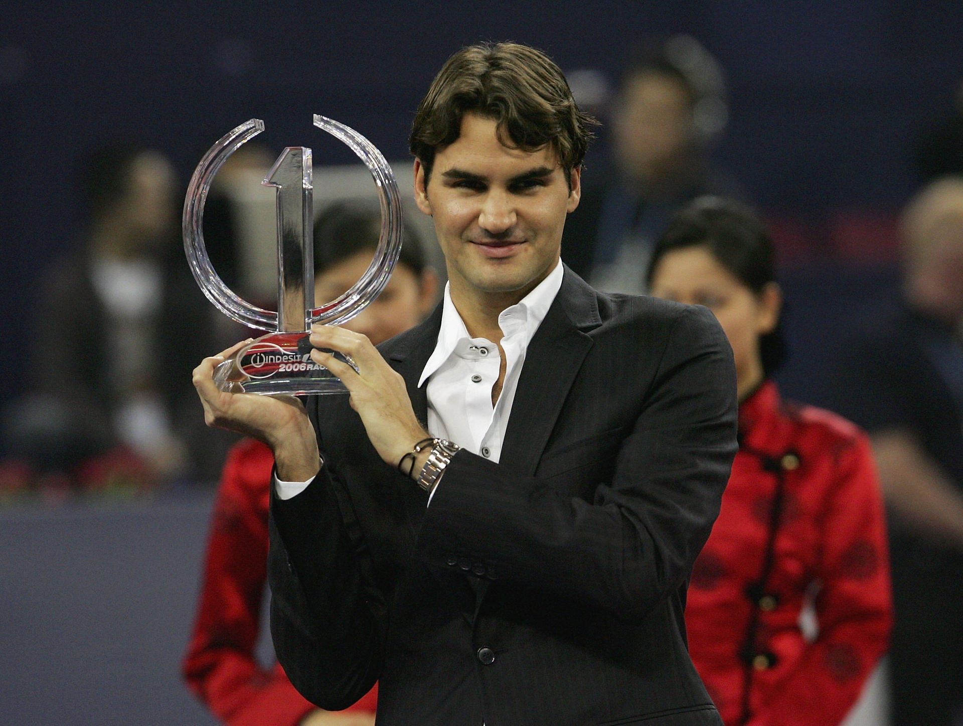 Roger Federer with his trophy for topping the 2006 ATP rankings at the 2006 Tennis Masters Cup