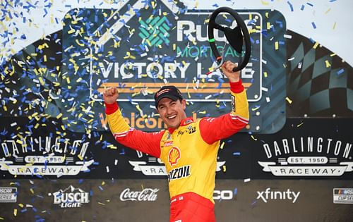 Joey Logano celebrates in the Ruoff Mortgage victory lane after winning the NASCAR Cup Series Goodyear 400 at Darlington Raceway (Photo by James Gilbert/Getty Images)