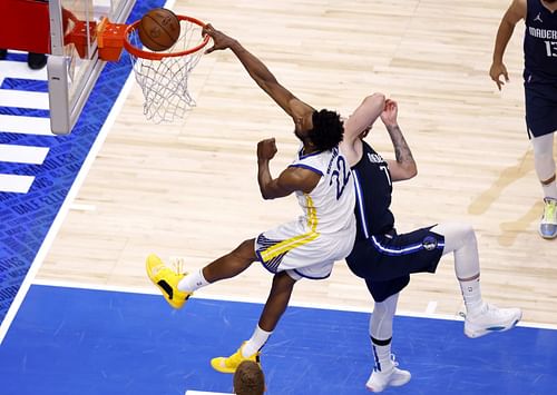 Andrew Wiggins serves up a poster on Luka Doncic