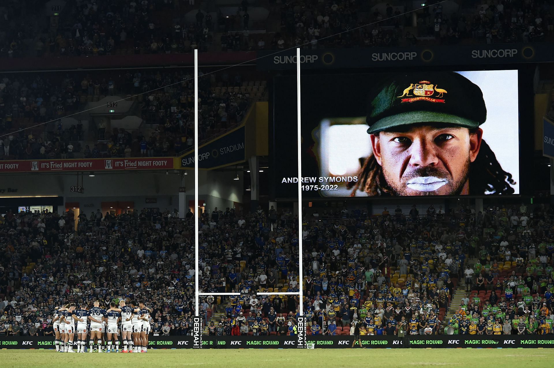 Players and spectators observe a minute of silence in honour of Andrew Symonds before a National Rugby League match in Australia
