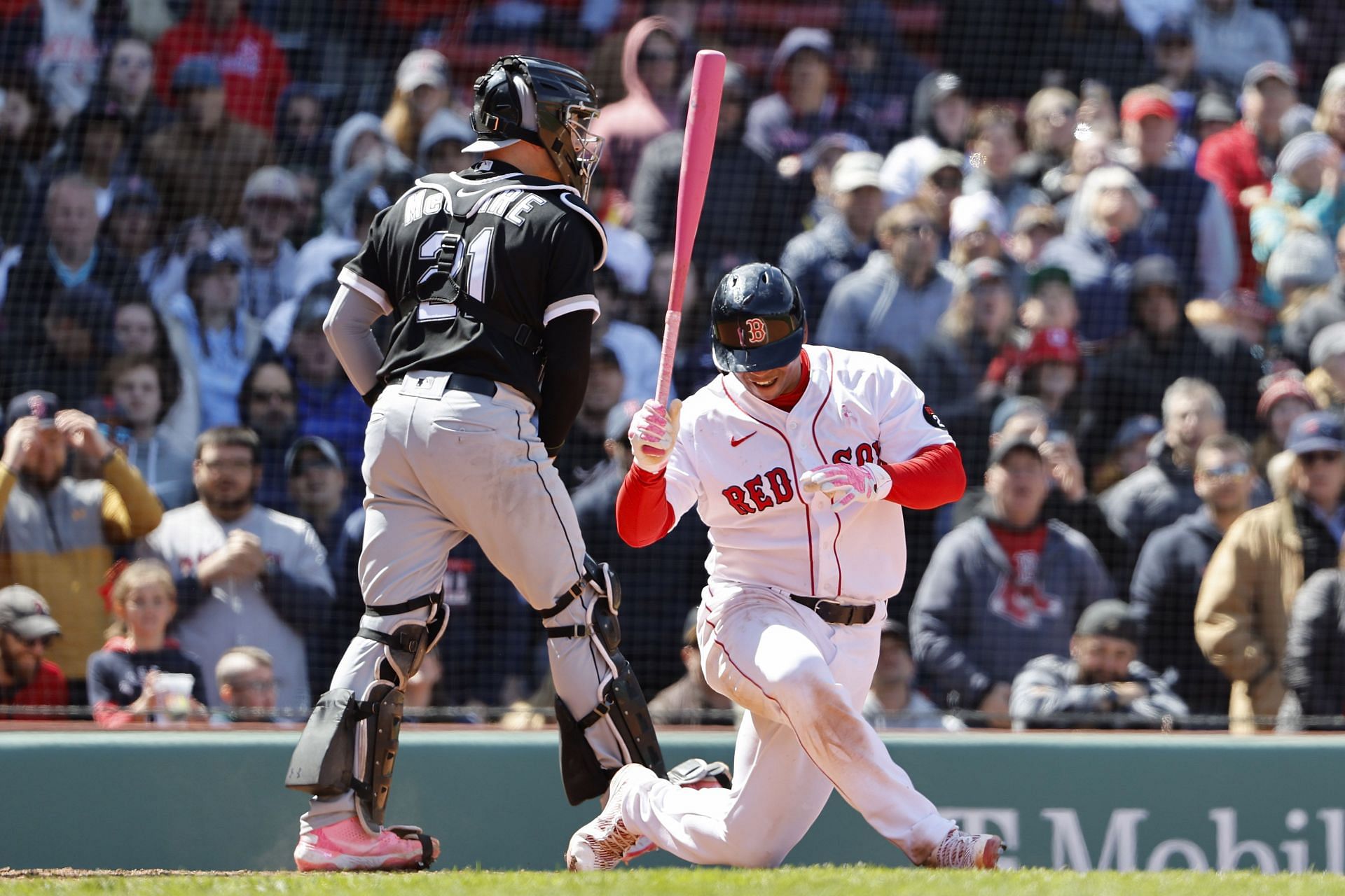 Rafael Devers of the Boston Red Sox goes to one knee after striking out.