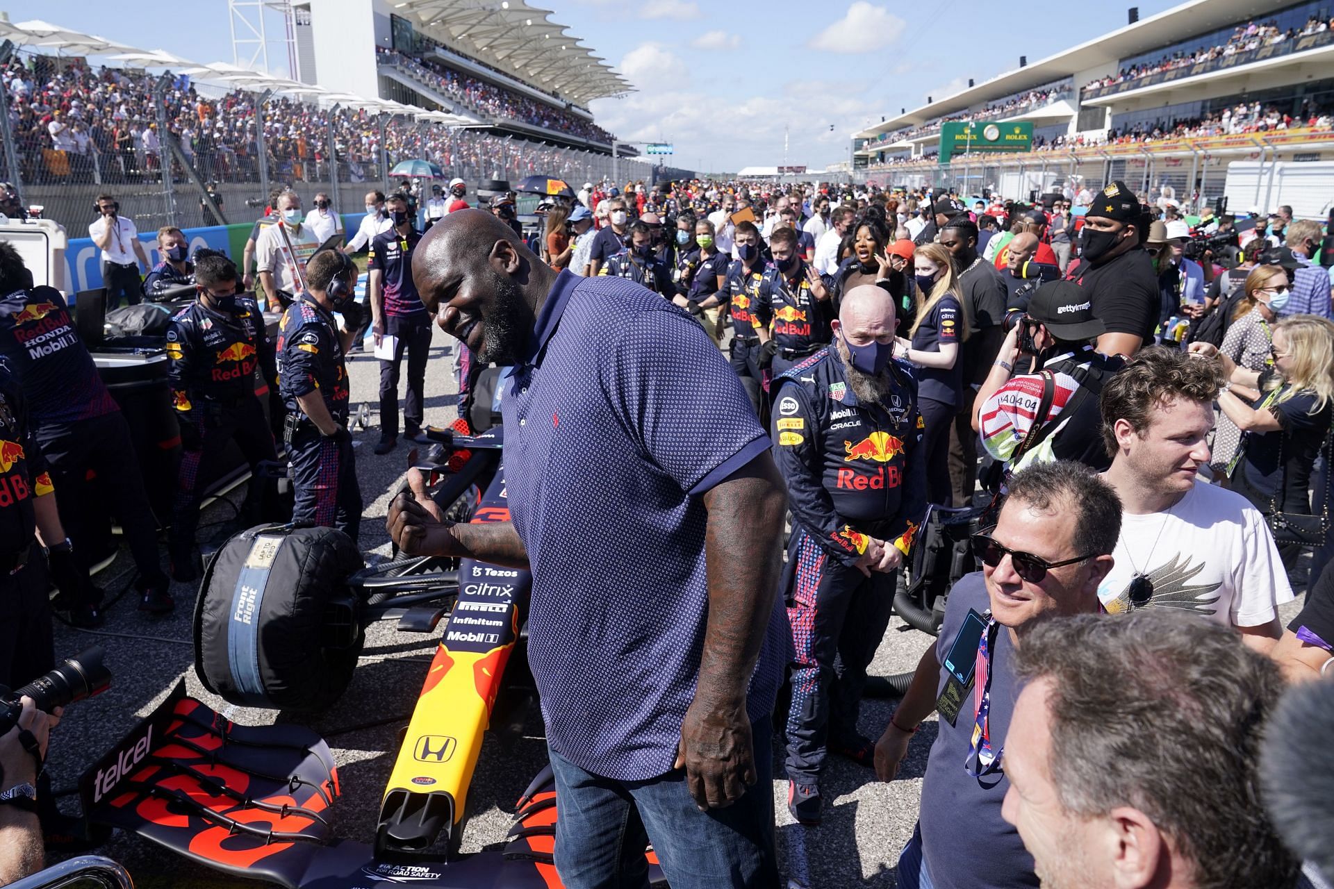 Shaquille O&#039;Neal poses for a photo with the car of Max Verstappen of Netherlands and Red Bull Racing on the grid before the F1 Grand Prix of USA at Circuit of The Americas on October 24, 2021 in Austin, Texas.