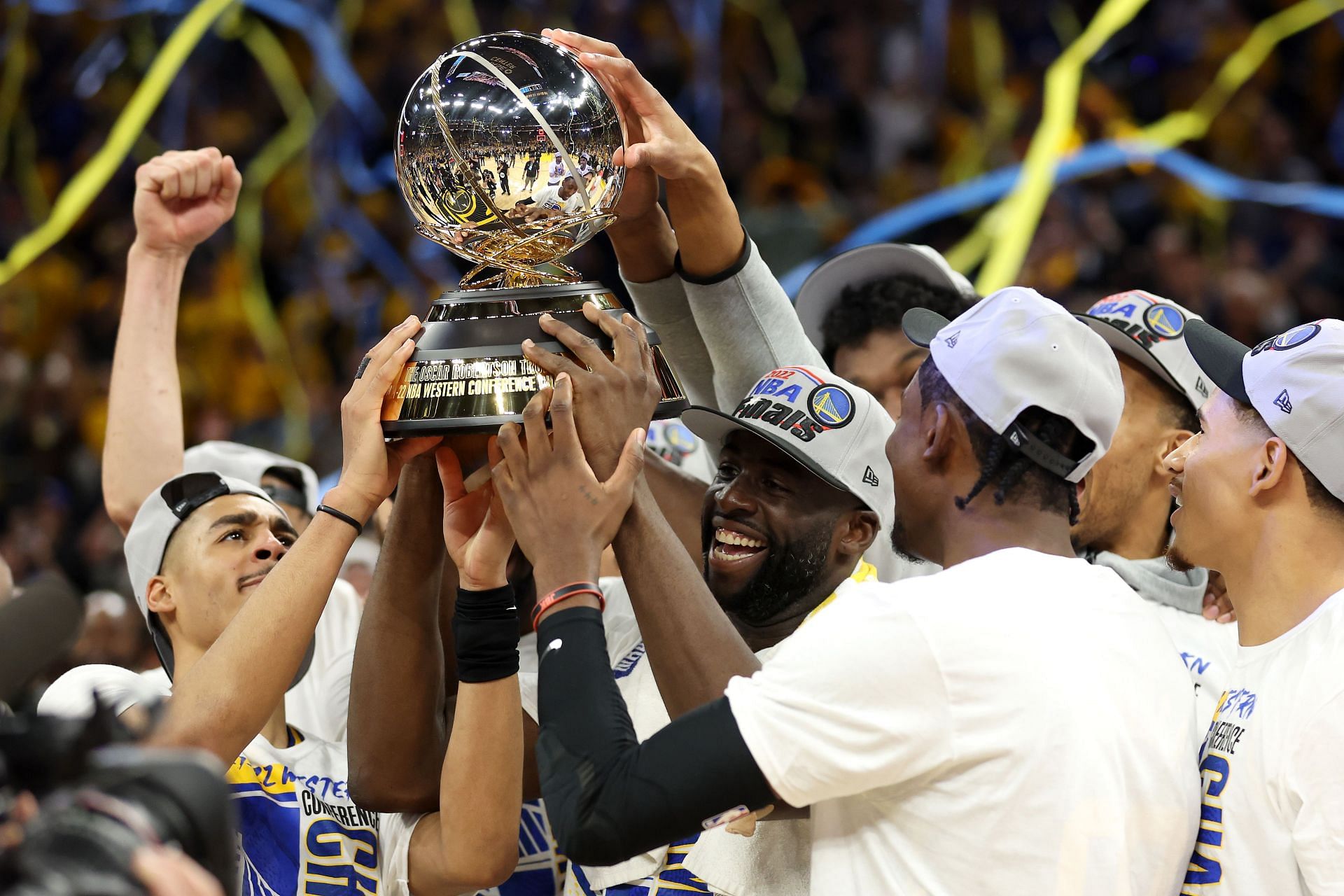 Draymond Green holding up the Western Conference Championship trophy