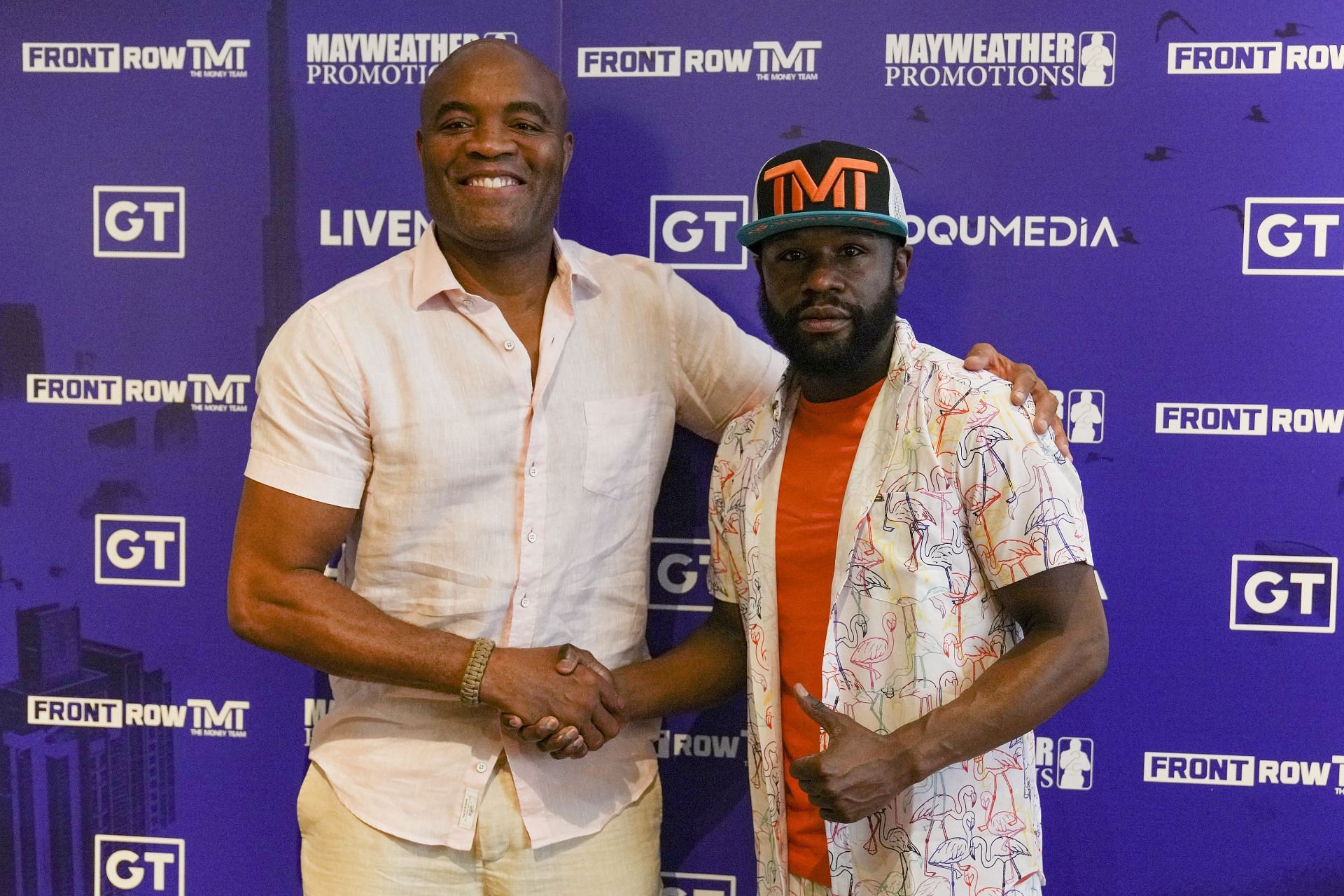 Anderson Silva (L) is thrilled to be fighting on the same card as Floyd Mayweather (R).