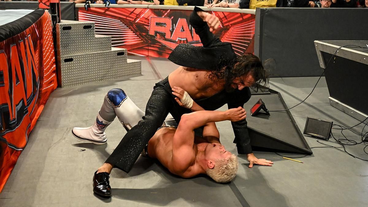 Seth Rollins and Cody Rhodes slug it out on the floor