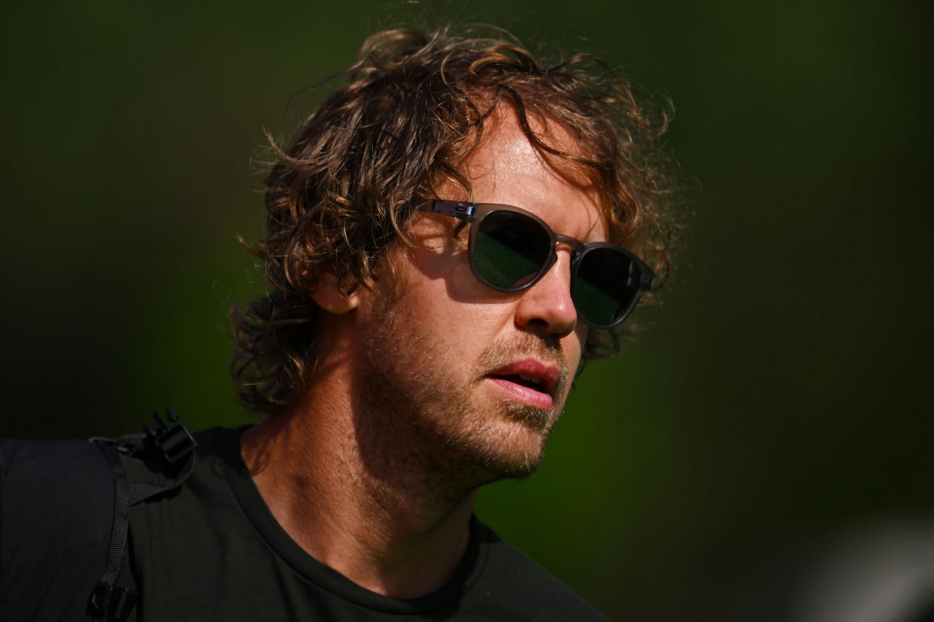 Sebastian Vettel walks in the Paddock before practice ahead of the F1 Grand Prix of Spain at Circuit de Barcelona-Catalunya on May 20, 2022, in Barcelona, Spain. (Photo by Clive Mason/Getty Images)