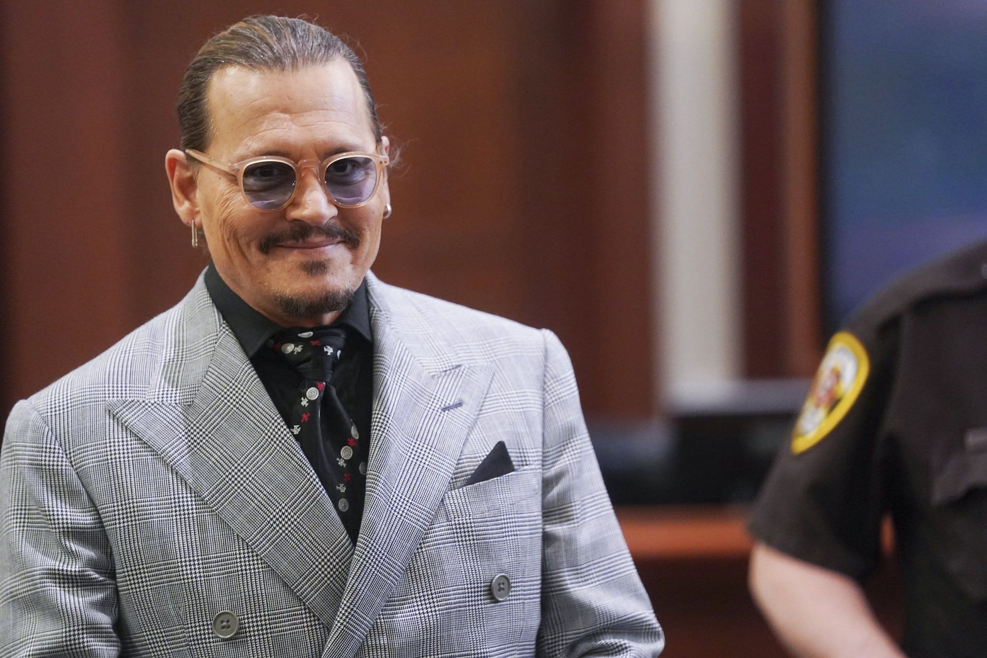 Video of Johnny Depp congratulating Stephanie Calnan goes viral (Image via AP)