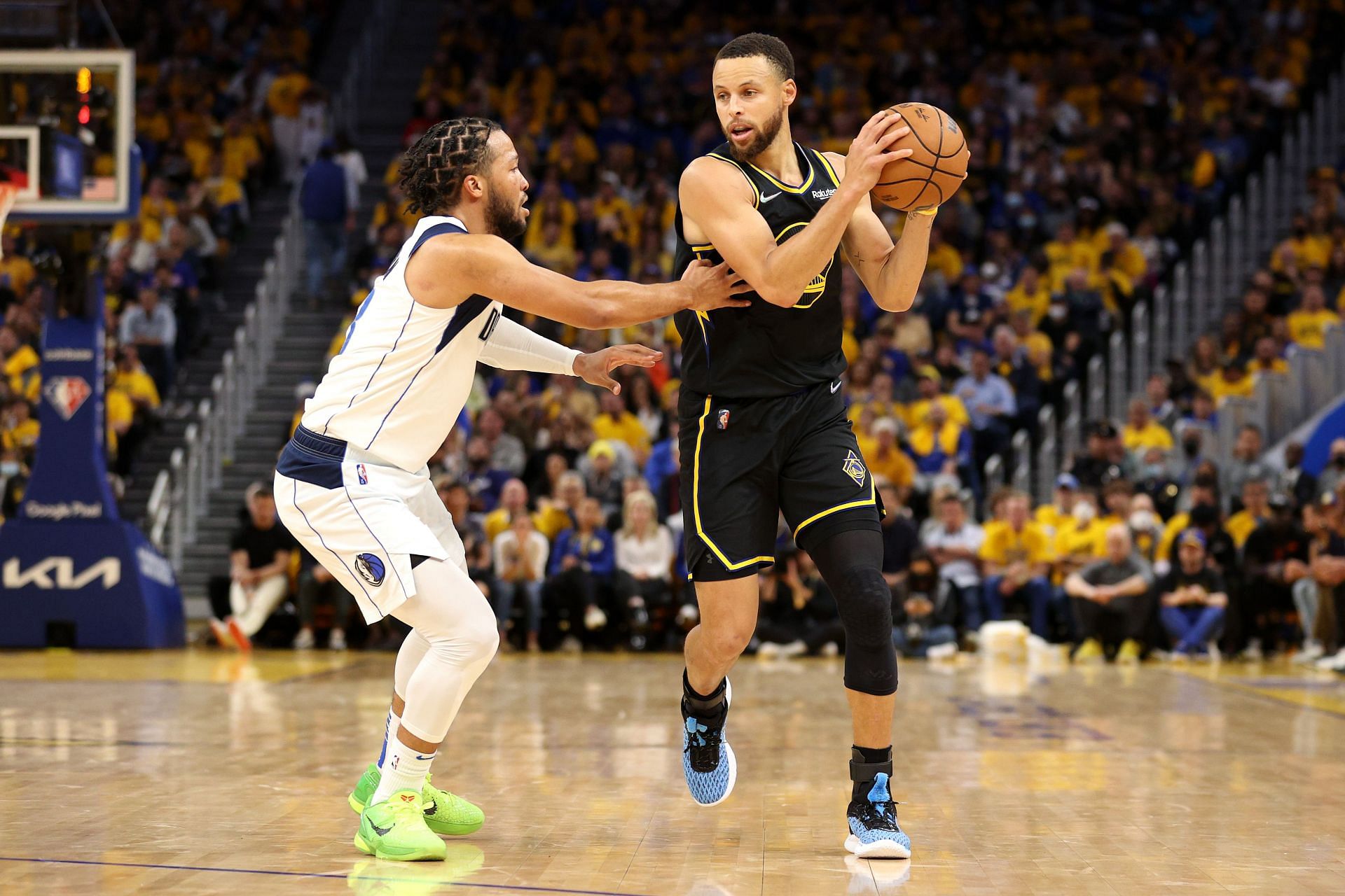 Steph Curry of the Golden State Warriors handles the ball against Jalen Brunson of the Dallas Mavericks during Game 5 of the Western Conference finals on Thursday in San Francisco, California.
