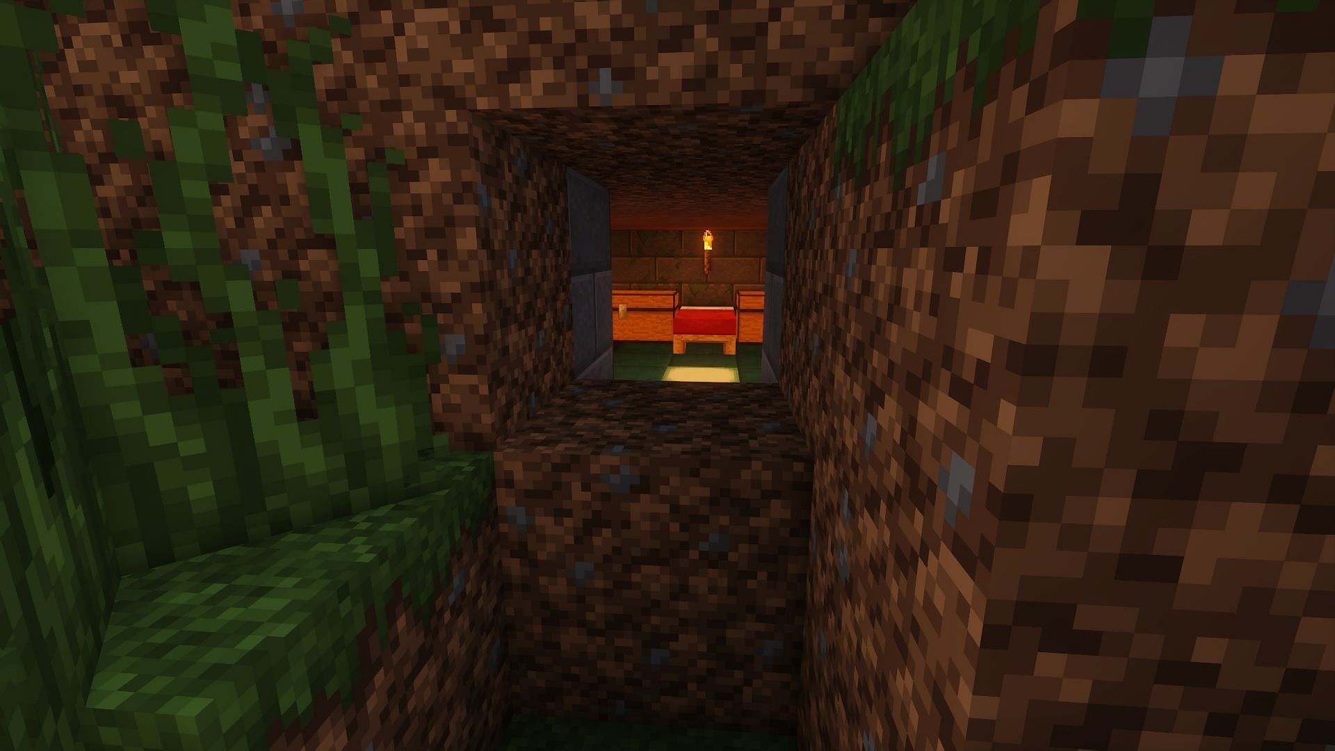 A starter base is hidden inside of a dirt hill (Image via Minecraft)