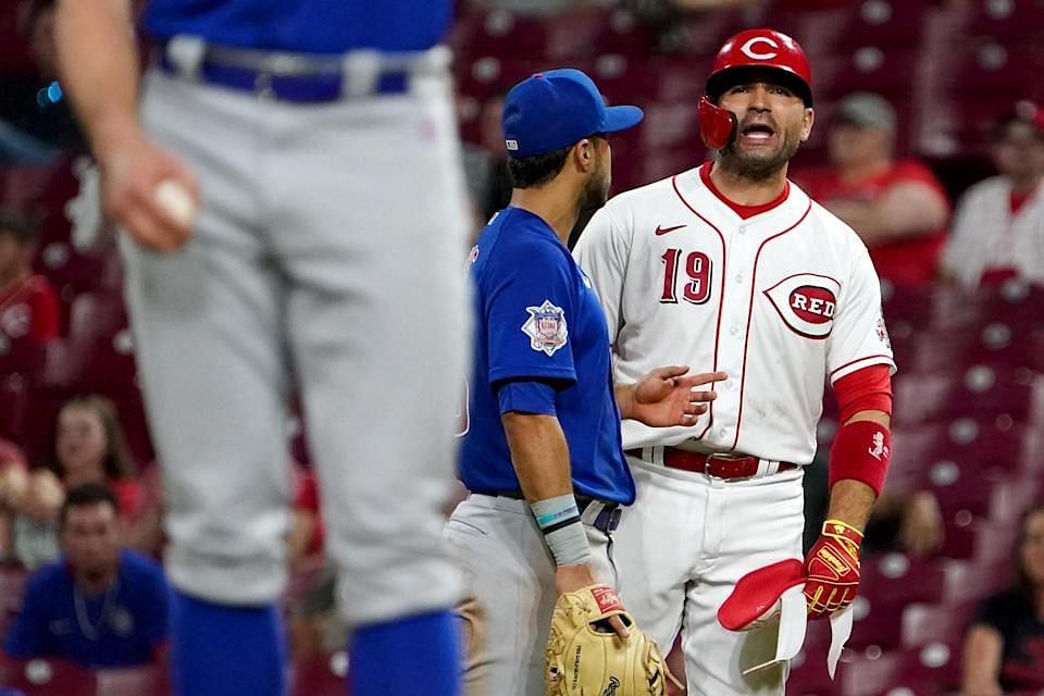 Joey Votto exchanges words with Chicago Cubs pitcher Rowan Wick after several pitches were thrown at the veteran first baseman.