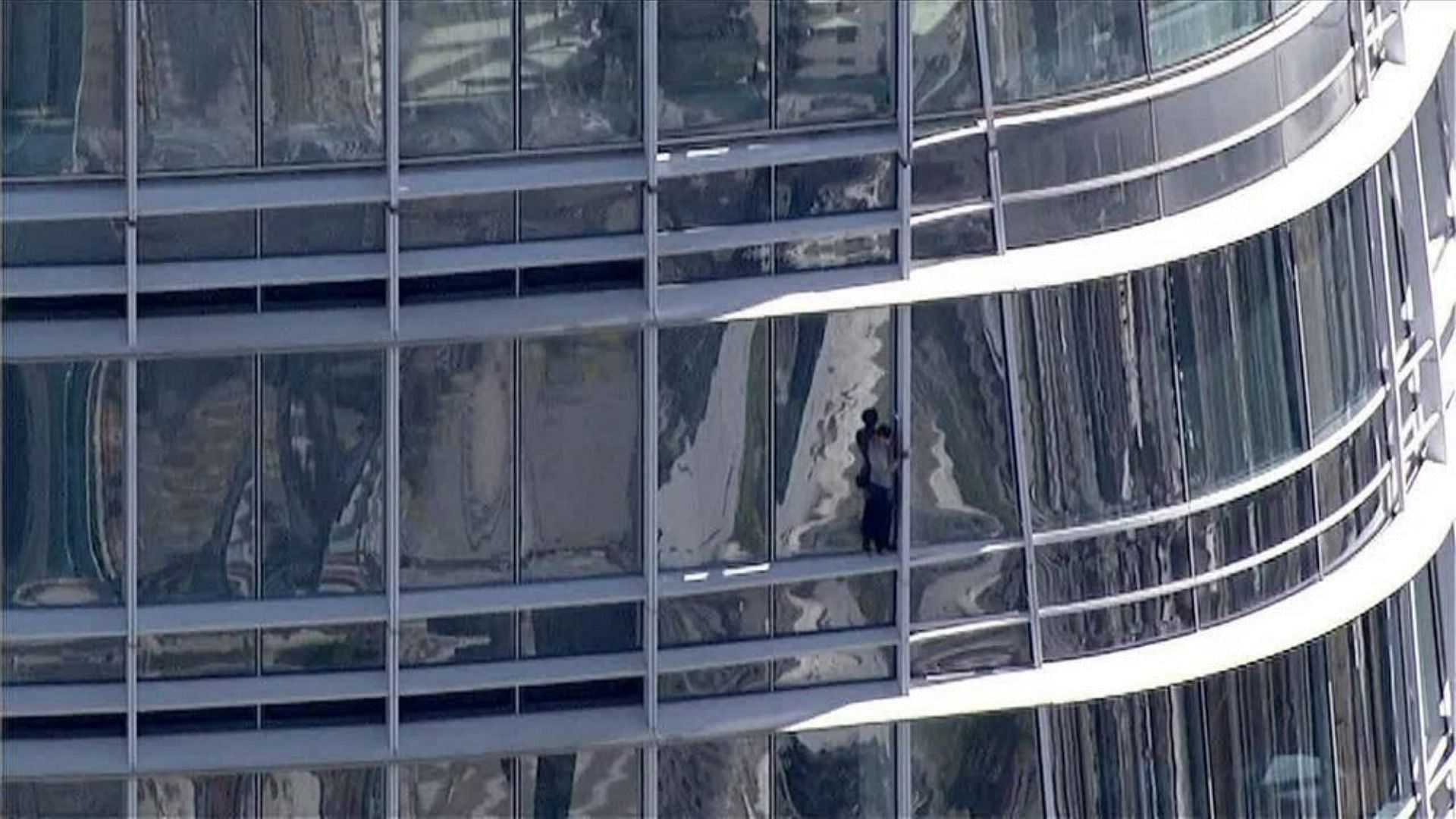 person climbing salesforce tower