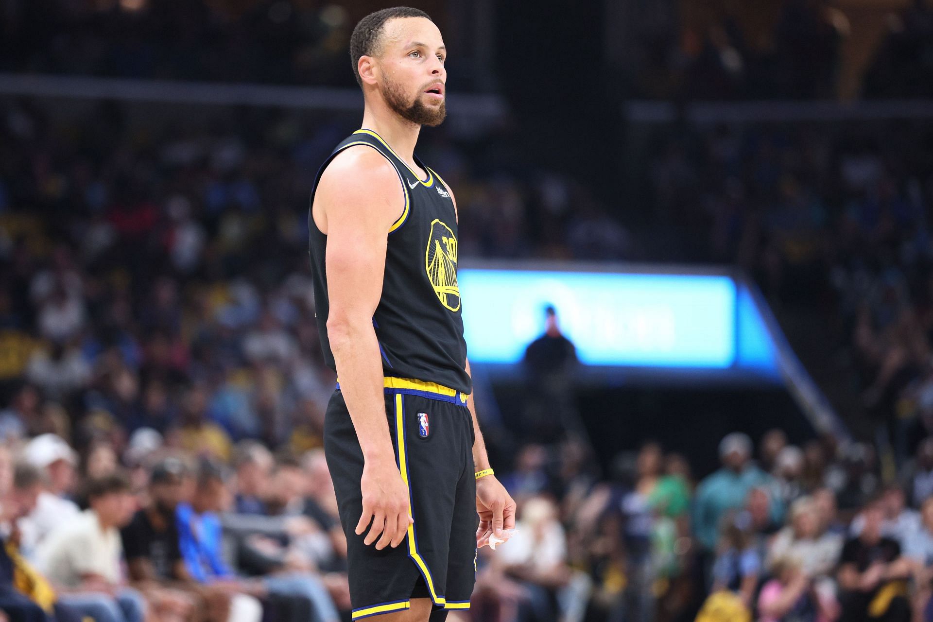 Steph Curry looks on at the game