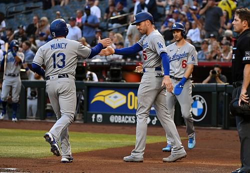 Los Angeles Dodgers' Max Muncy, Freddie Freeman, and Trea Turner