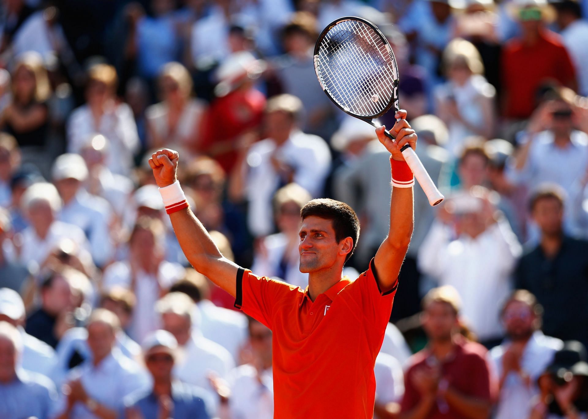 2015 French Open - Day 11 - Novak Djokovic exults after beating Rafael Nadal