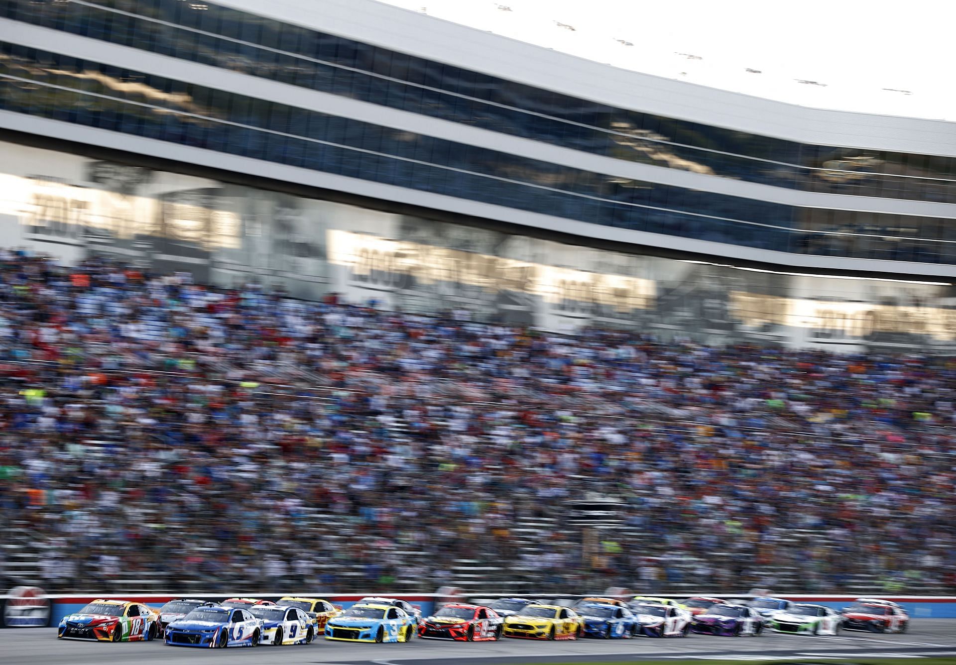 .Kyle Larson, driver of the #5 HendrickCars.com Chevrolet, and Kyle Busch, driver of the #18 M&amp;M&#039;s Summering Toyota, lead the field during the NASCAR All-Star Race at Texas Motor Speedway (Photo by Jared C. Tilton/Getty Images)
