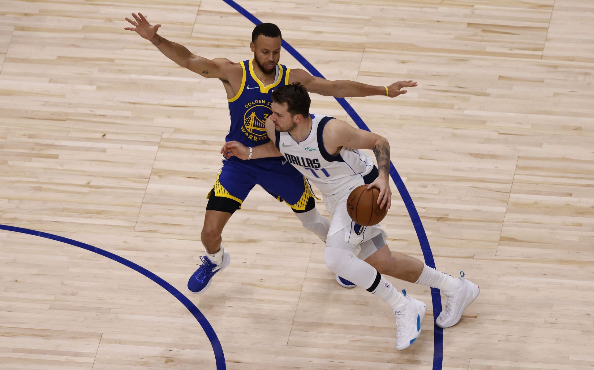 Luka Doncic of the Dallas Mavericks against Steph Curry of the Golden State Warriors