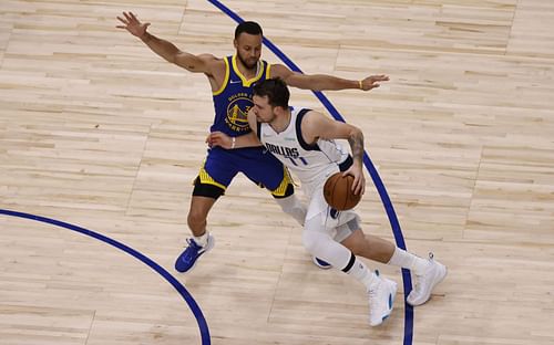 Luka Doncic of the Dallas Mavericks against Steph Curry of the Golden State Warriors