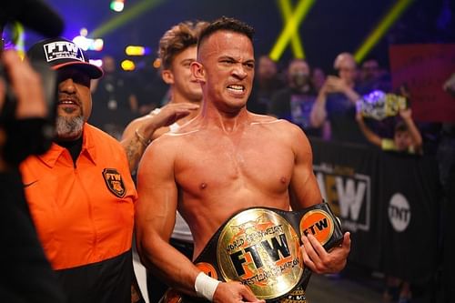 Team Taz celebrating with FTW Champion Ricky Starks in AEW.