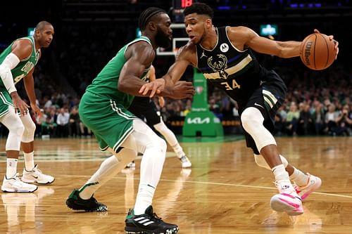 Jaylen Brown #7 of the Boston Celtics defends Giannis Antetokounmpo #34 of the Milwaukee Bucks