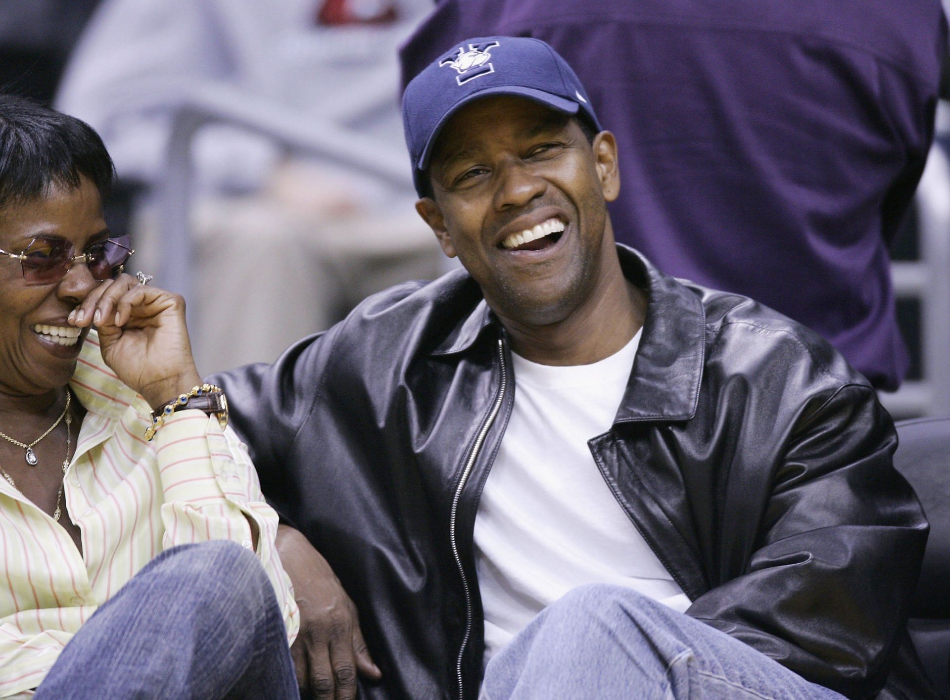 Actor Denzel Washington attending a game