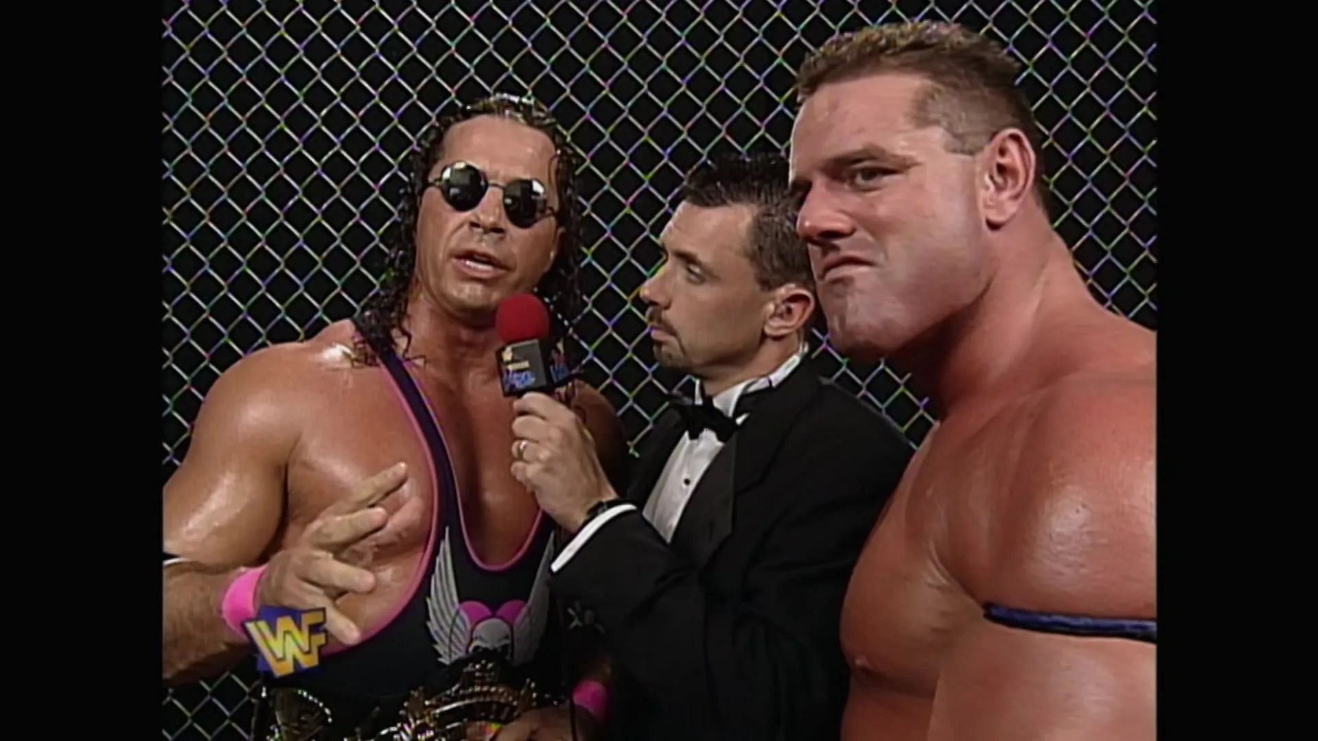 Bret Hart with Michael Cole and The British Bulldog