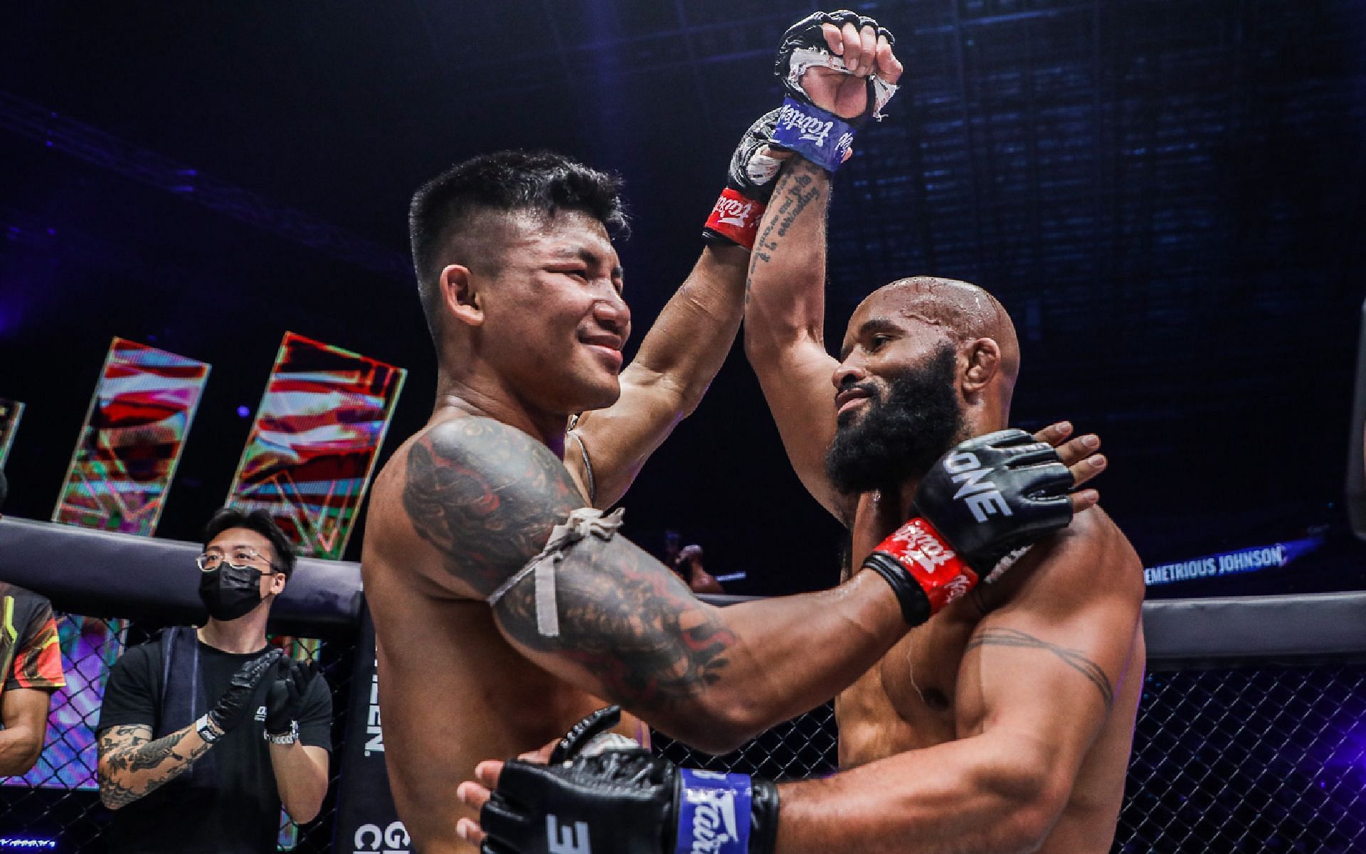 Rodtang Jitmuangnon (left) raises Demetrious Johnson&#039;s (right) hand after their mixed rules fight at ONE X. [Photo ONE Championship]