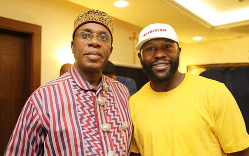 Chibuike Amaechi poses with Floyd Mayweather at his residence in Abuja, Nigeria