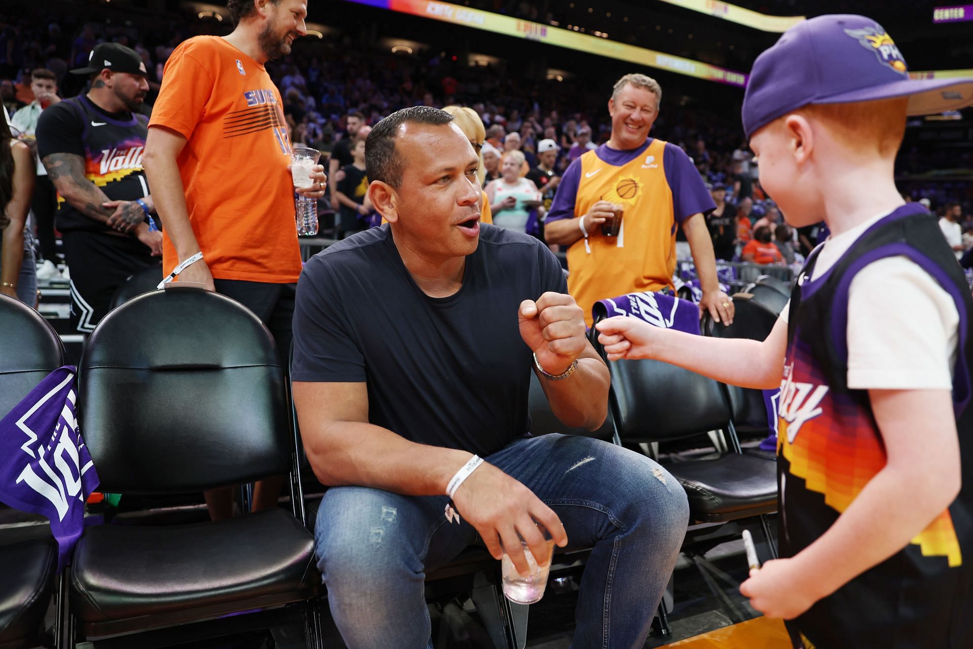 A-Rod seen greeting a young fan at Game Seven of the NBA Western Semis between the Dallas Mavericks v Phoenix Suns at the Footprint Center in Pheonix