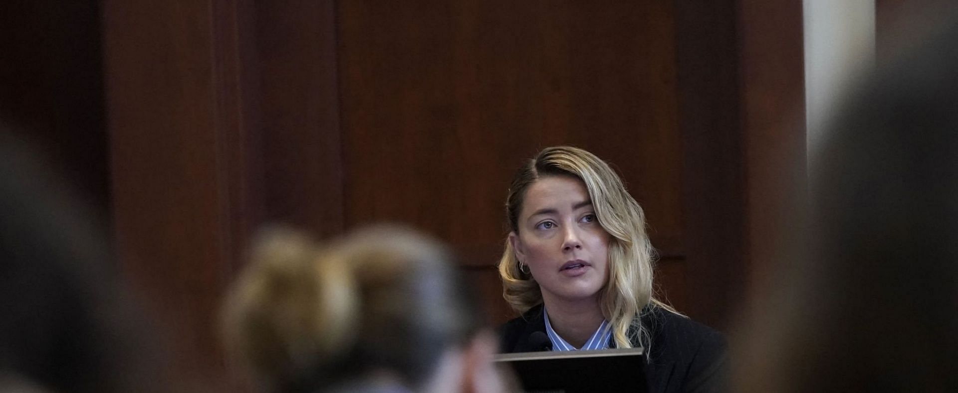 Netizens took to Twitter to react Amber Heard crying during testimony (Image via Getty Images)