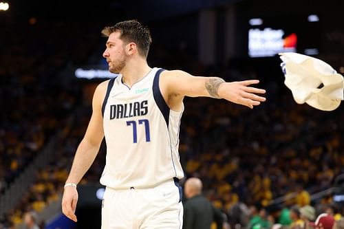 Luka Doncic No. 77 of the Dallas Mavericks throws a towel during the fourth quarter.