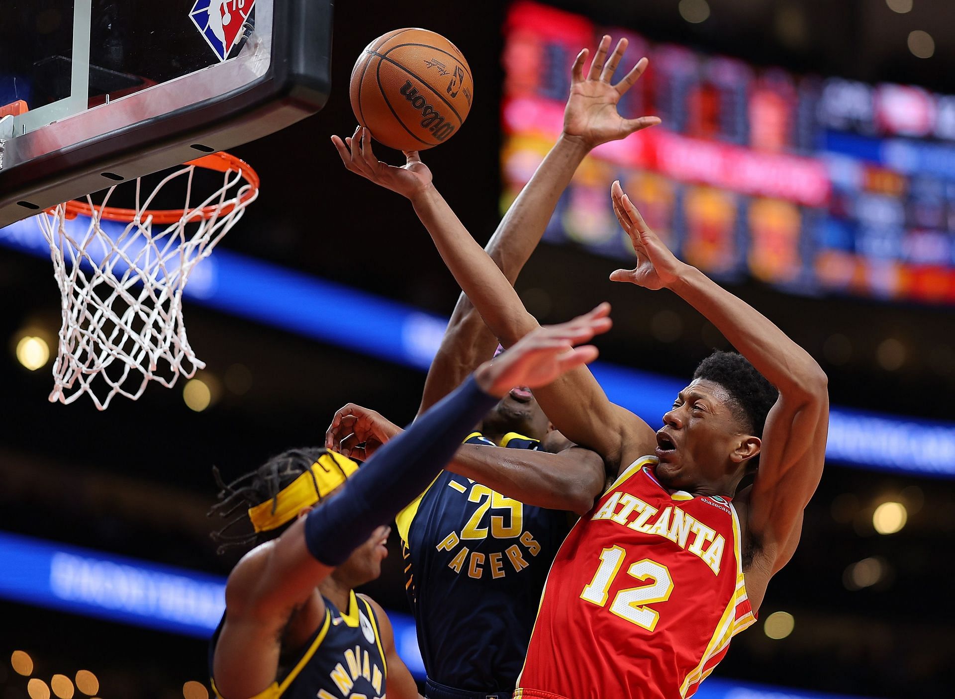 De'Andre Hunter of the Atlanta Hawks draws a foul as he attacks the basket.