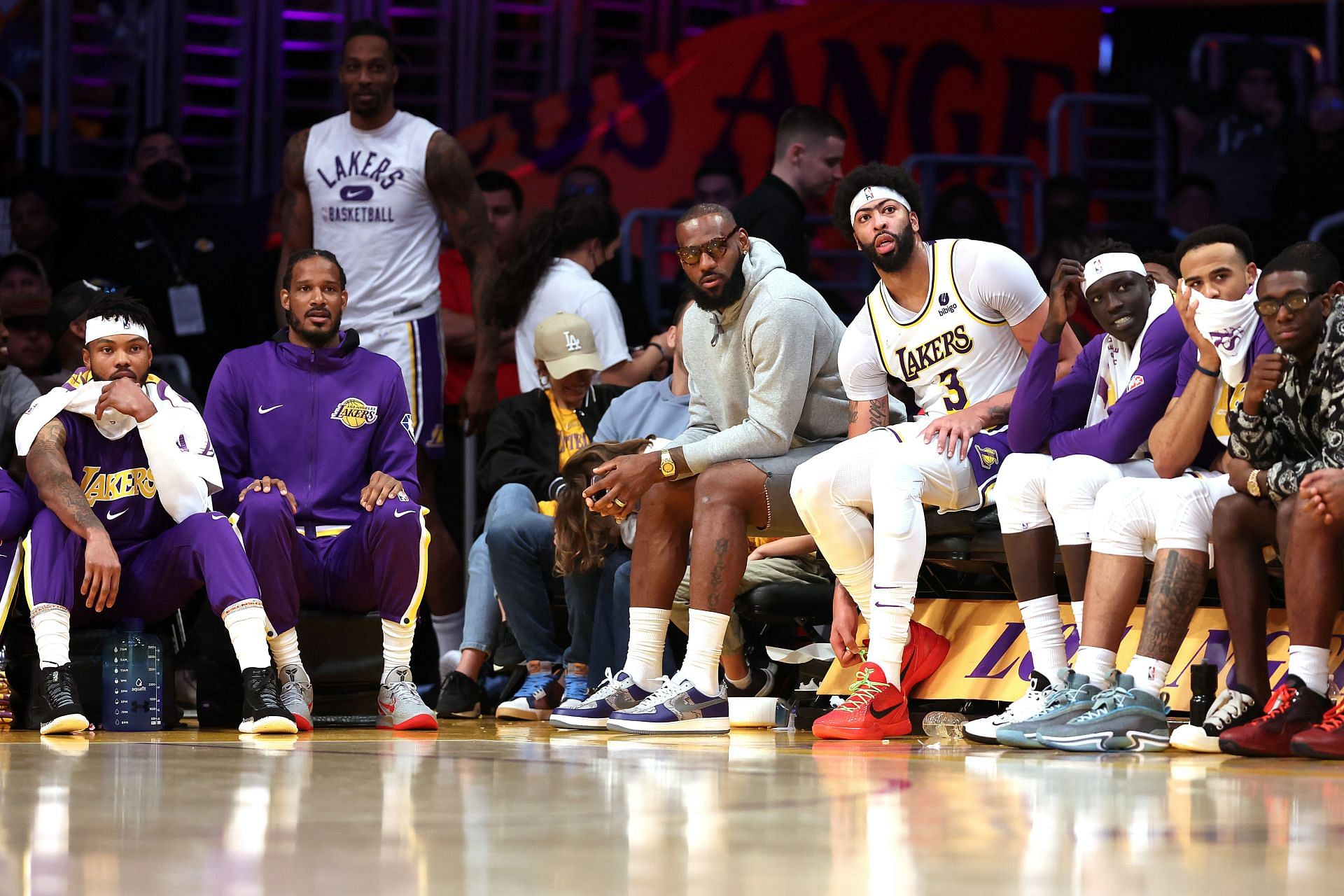 LeBron James #6 and Anthony Davis #3 of the LA Lakers look on from the bench.