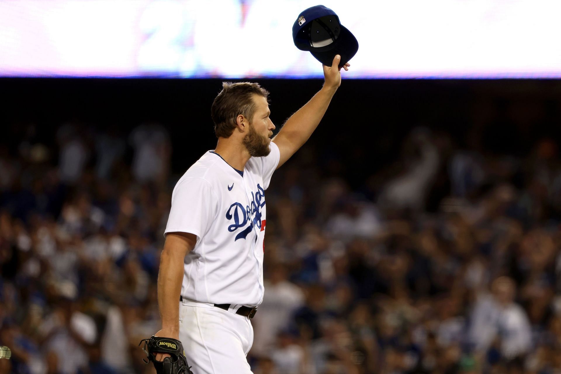 Los Angeles Dodgers southpaw Clayton Kershaw tips his cap to the fans as they give him a thunderous ovation for passing Don Sutton&#039;s record for most strikeouts acquired by a pitcher in a Los Angeles Dodgers uniform.