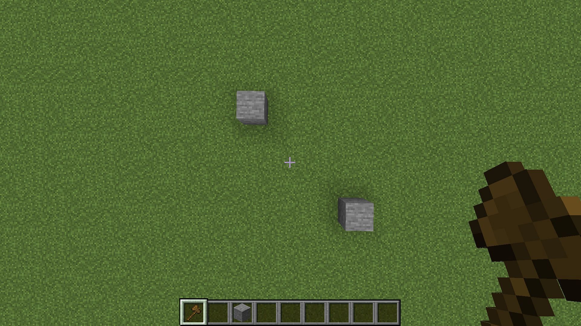 Selecting two diagonally opposite blocks to create a 2D square selection with wooden pickaxe (Image via Minecraft)