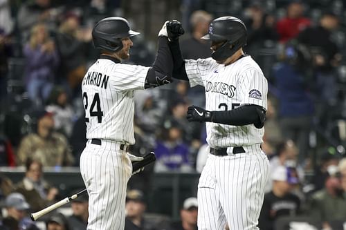 C.J. Cron of the Colorado Rockies celebrates with Ryan McMahon after hitting a home run against the Washington Nationals.