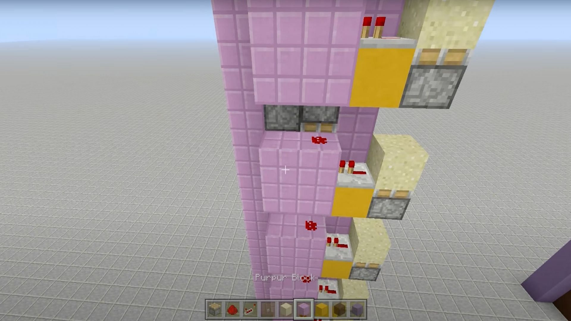 Break each block next to the redstone dust along the back of the structure (Image via Fed X Gaming/YouTube)